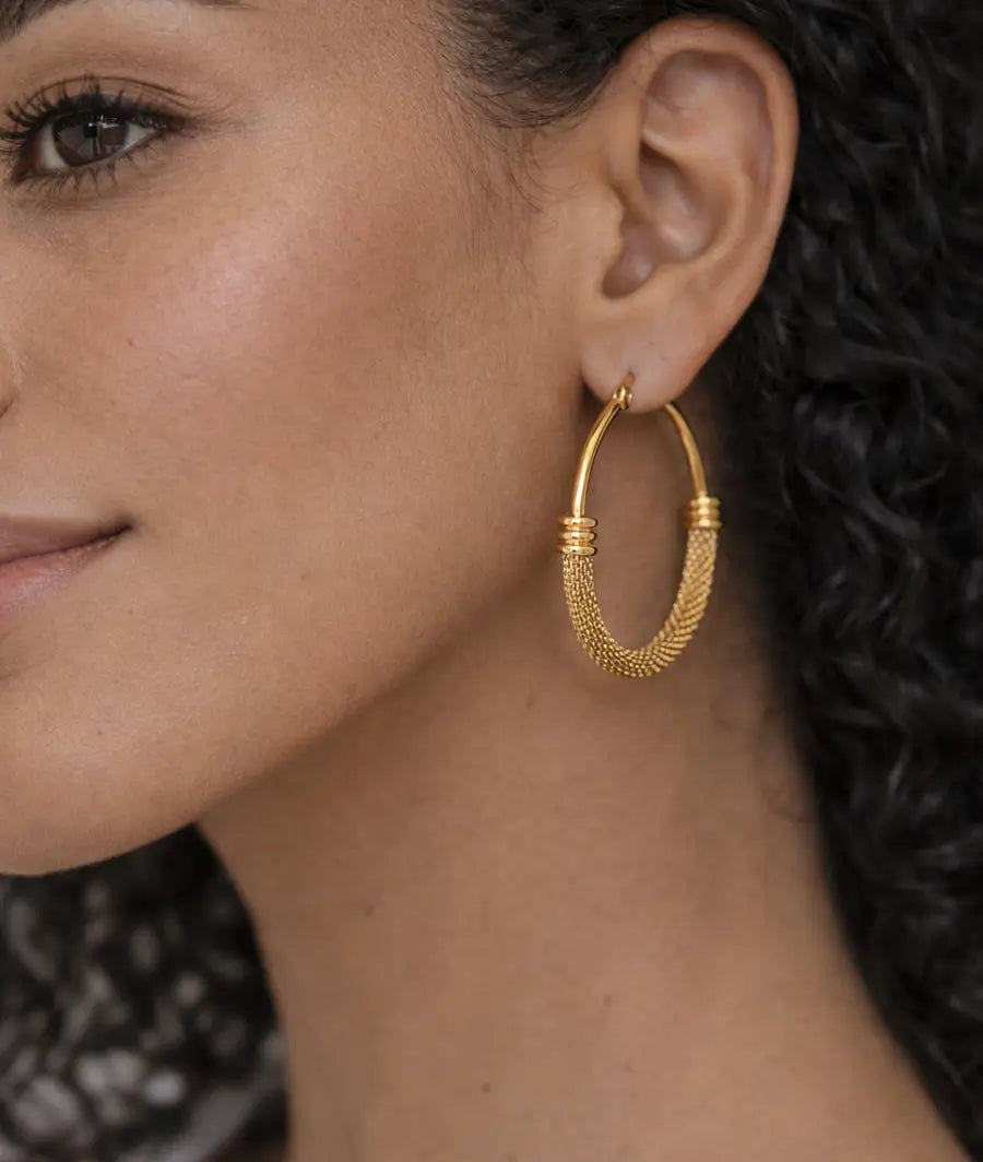 TORQUE SCULPTURAL HOOP EARRINGS
