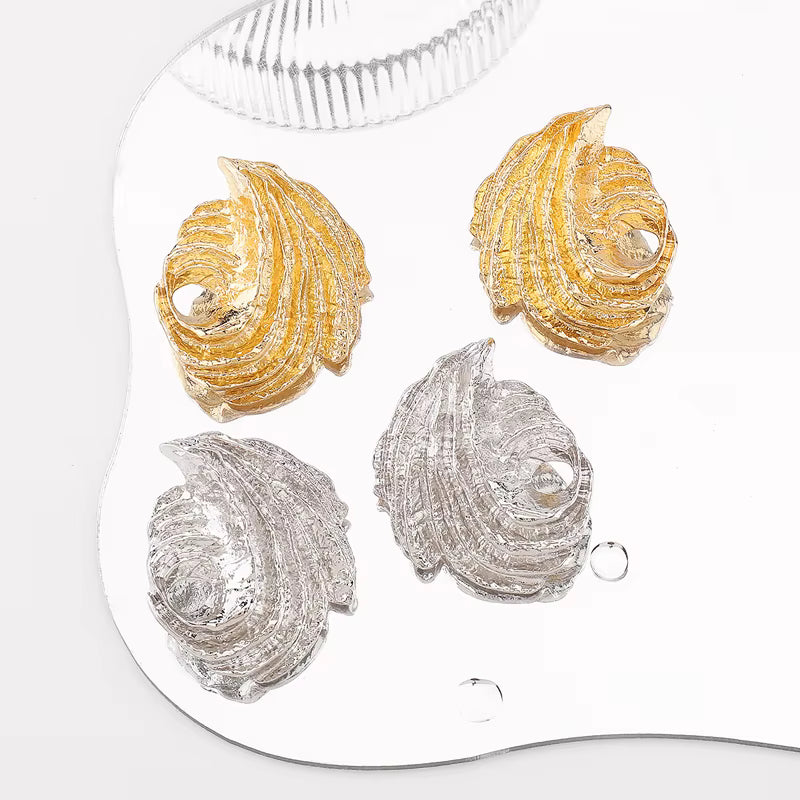 SEA SCULPTED SHELL STUD EARRINGS