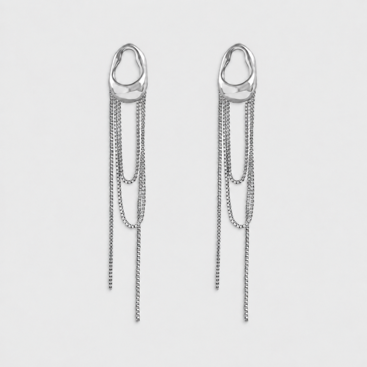 VILOA CHUTE Silver sculptural earrings, pair on light gray background